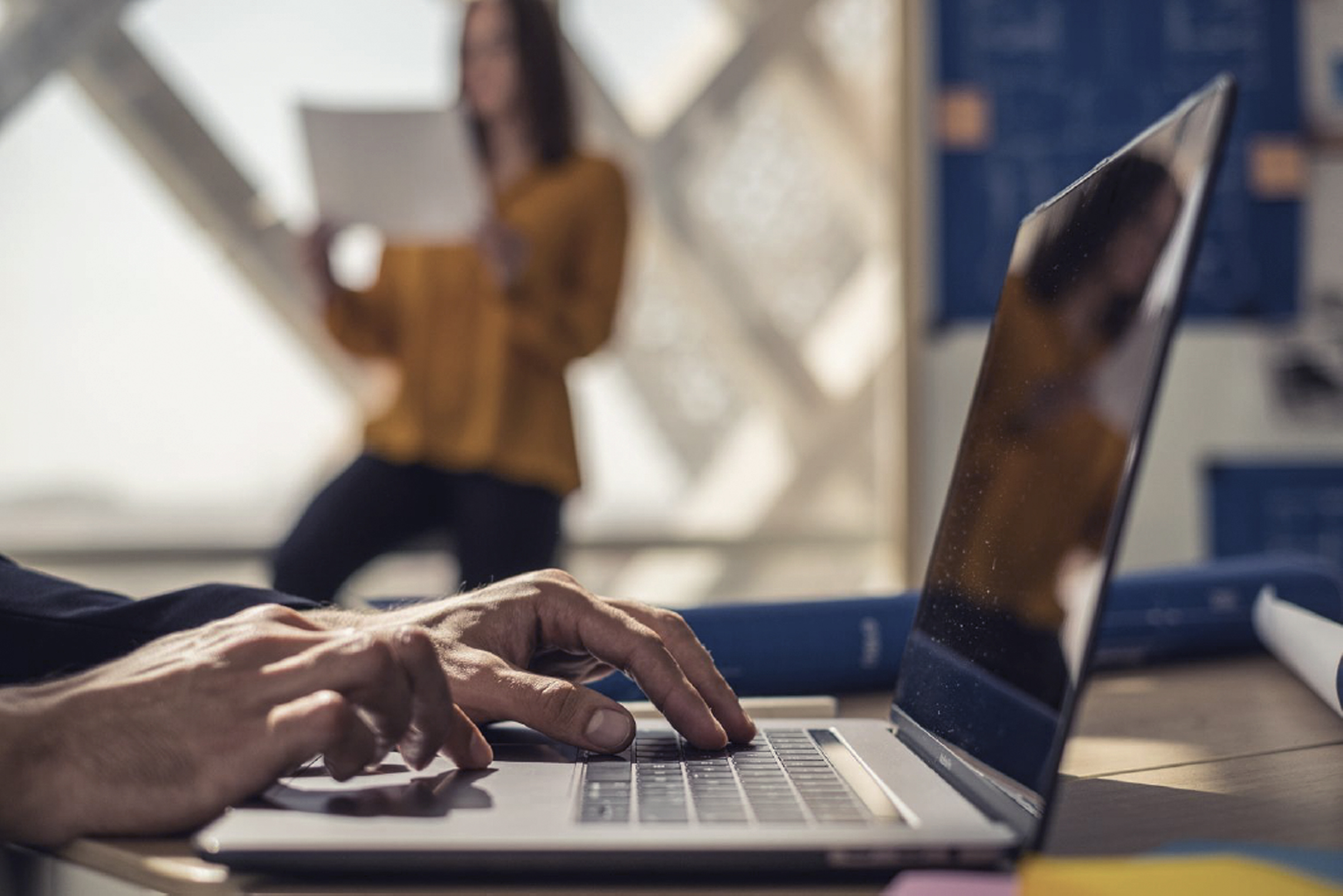 Hamad Port cargo loading, large yellow container cranes placing containers on cargo ships